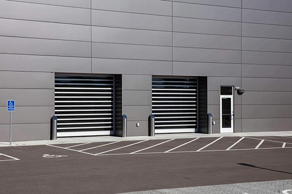 Spiral-FV doors on gray dealership building