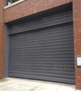 Spiral-VT Parking Garage Door on Brick Building